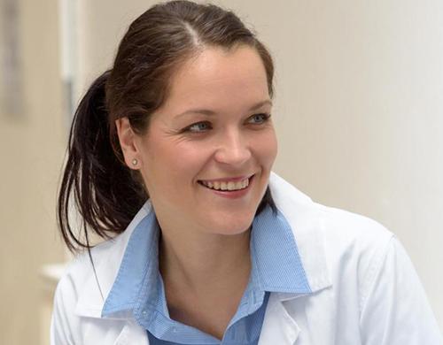 Public Health Nurse Smiling with Patient in Consultation