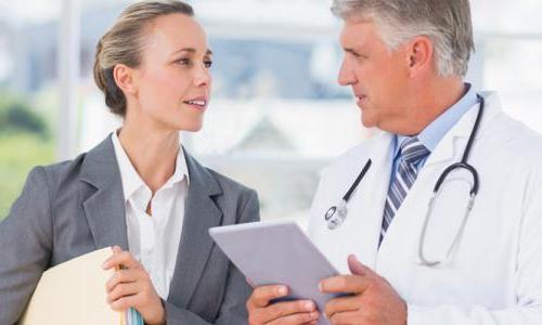 Healthcare Administrator Consulting with Doctor